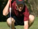 Sizing up a putt.
